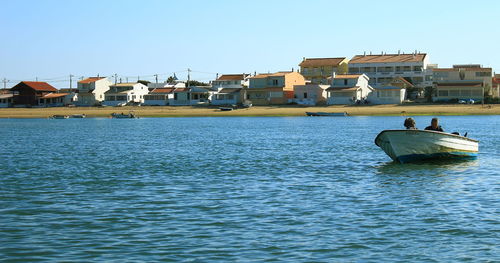 Scenic view of sea against clear blue sky