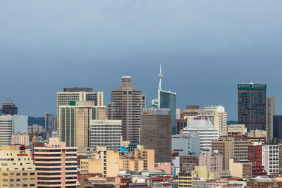 Modern buildings in city against sky