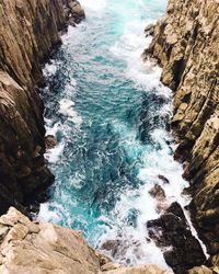High angle view of rocks in sea