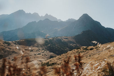 Scenic view of landscape and mountains against sky