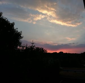 Silhouette trees against sky during sunset