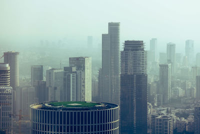 Modern buildings in city against sky