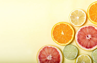 Close-up of orange fruits against white background