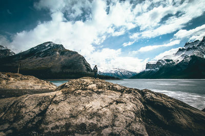 Scenic view of snowcapped mountains by sea against sky