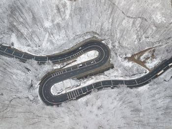 High angle view of snow covered car on road