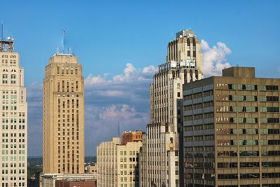 Buildings in city against sky