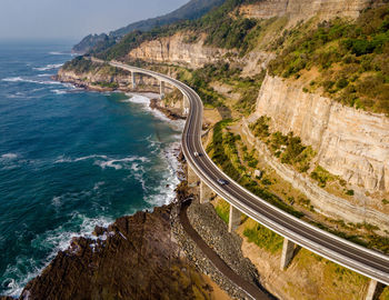 High angle view of road leading towards sea