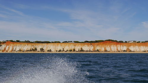 Colorful coastline of algarve seen from boat