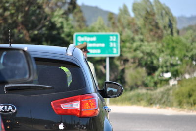 Close-up of car on road