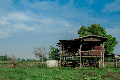 House on field against sky