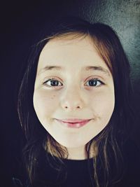 Close-up portrait of smiling girl 