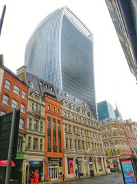 Low angle view of skyscrapers against sky