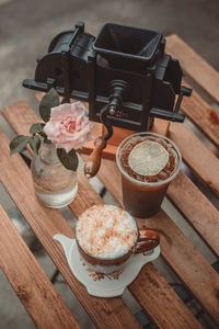 High angle view of coffee and cookies on table