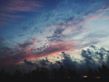 Scenic view of dramatic sky at sunset