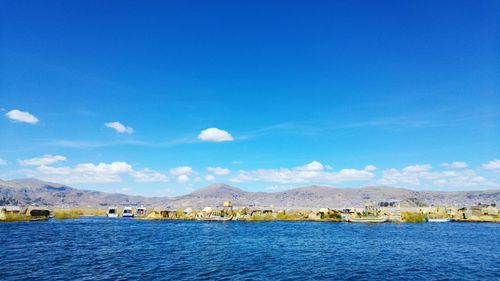 Scenic view of lake against blue sky