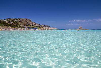 Scenic view of sea against blue sky