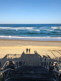 Scenic view of beach against clear sky