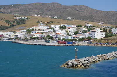 Scenic view of sea and buildings in town