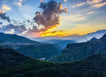 Scenic view of mountains against sky during sunset