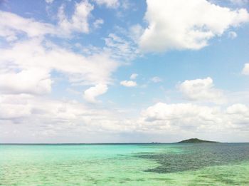 View of calm sea against cloudy sky