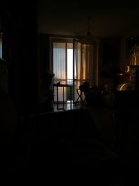 Man on table by window at home