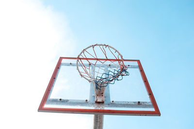 Low angle view of basketball hoop against clear sky