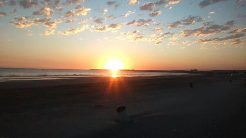 Scenic view of beach at sunset