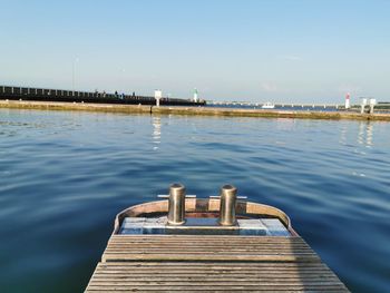 Pier over lake against sky