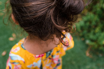 Little girl with curls outside
