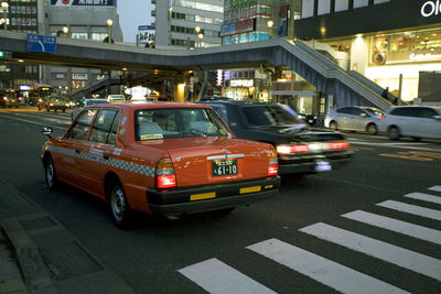 Cars on street in city at night