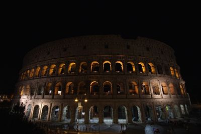 Low angle view of historical building at night