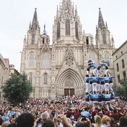 Group of people in front of building against sky