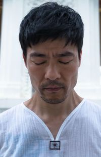 Portrait of man with eyes closed