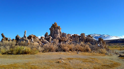 Scenic view of landscape against clear blue sky