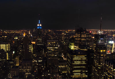 Illuminated buildings in city at night