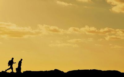 Silhouette man at sunset