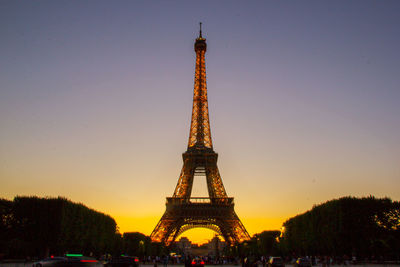 Low angle view of tower against sky during sunset