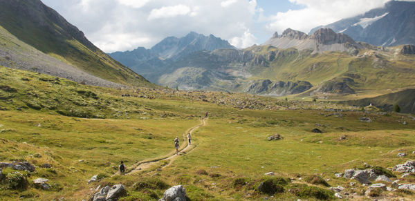 Hikers in the high mountains in the alps in tignes in summer