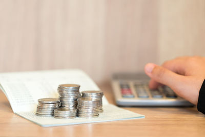 Close-up of hand holding coins