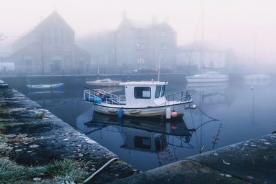 Boats moored at harbor