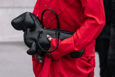 Midsection of man with backpack