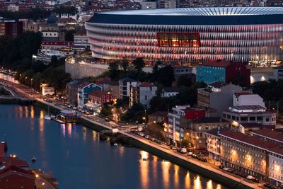 High angle view of city lit up at night