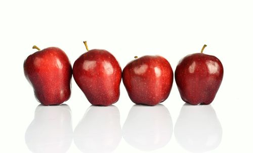 Close-up of apples on white background