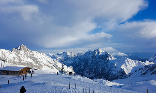 Scenic view of snowcapped mountains against sky