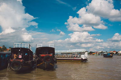 Boats in sea against sky