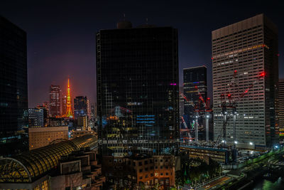 High angle view of illuminated buildings in city at night