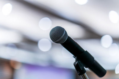 Close-up of microphone in auditorium