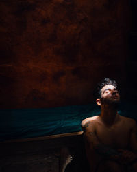 Portrait of young man looking at sea