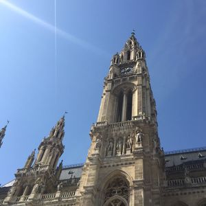 Low angle view of clock tower against sky