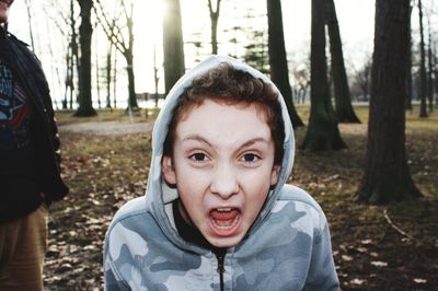 Portrait of boy in forest